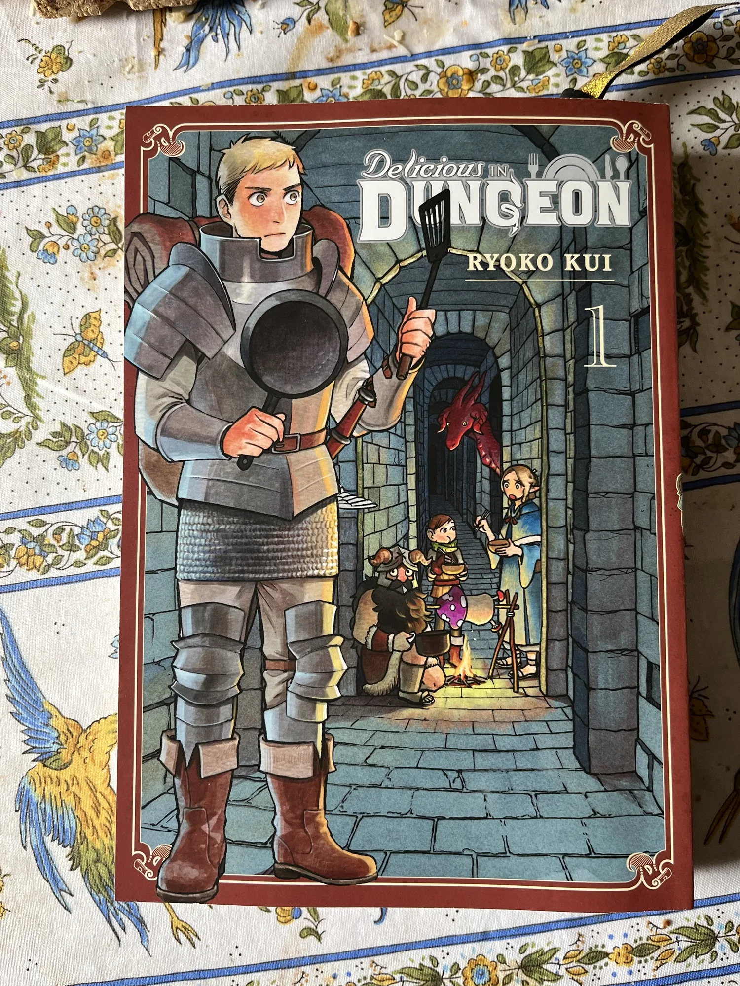 A photo of the first book in the Delicious in Dungeon manga series.