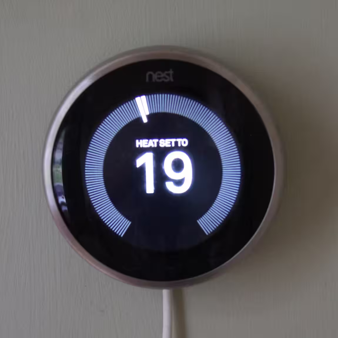 A photo of our Nest thermostat with the heating set to 19 C
