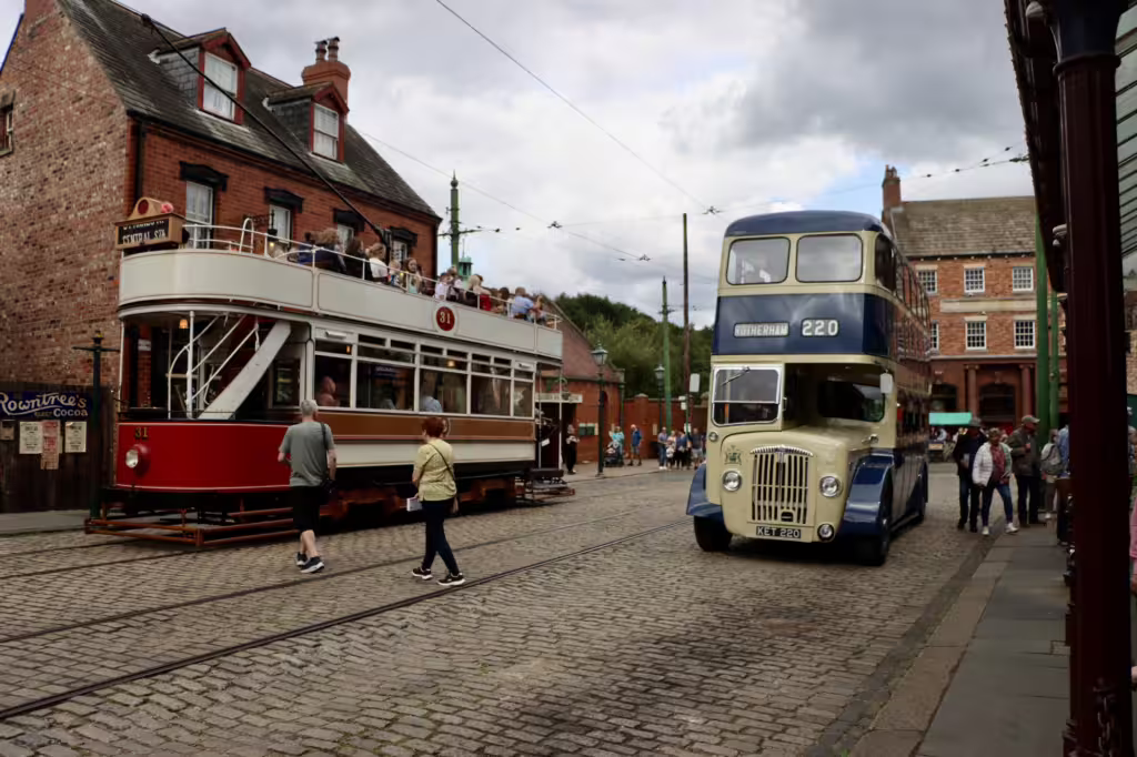 A tram and a bus in the 1900s town in Beamish