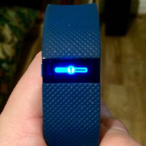 A photo of a Fitbit Charge HR which is stuck on a firmware update