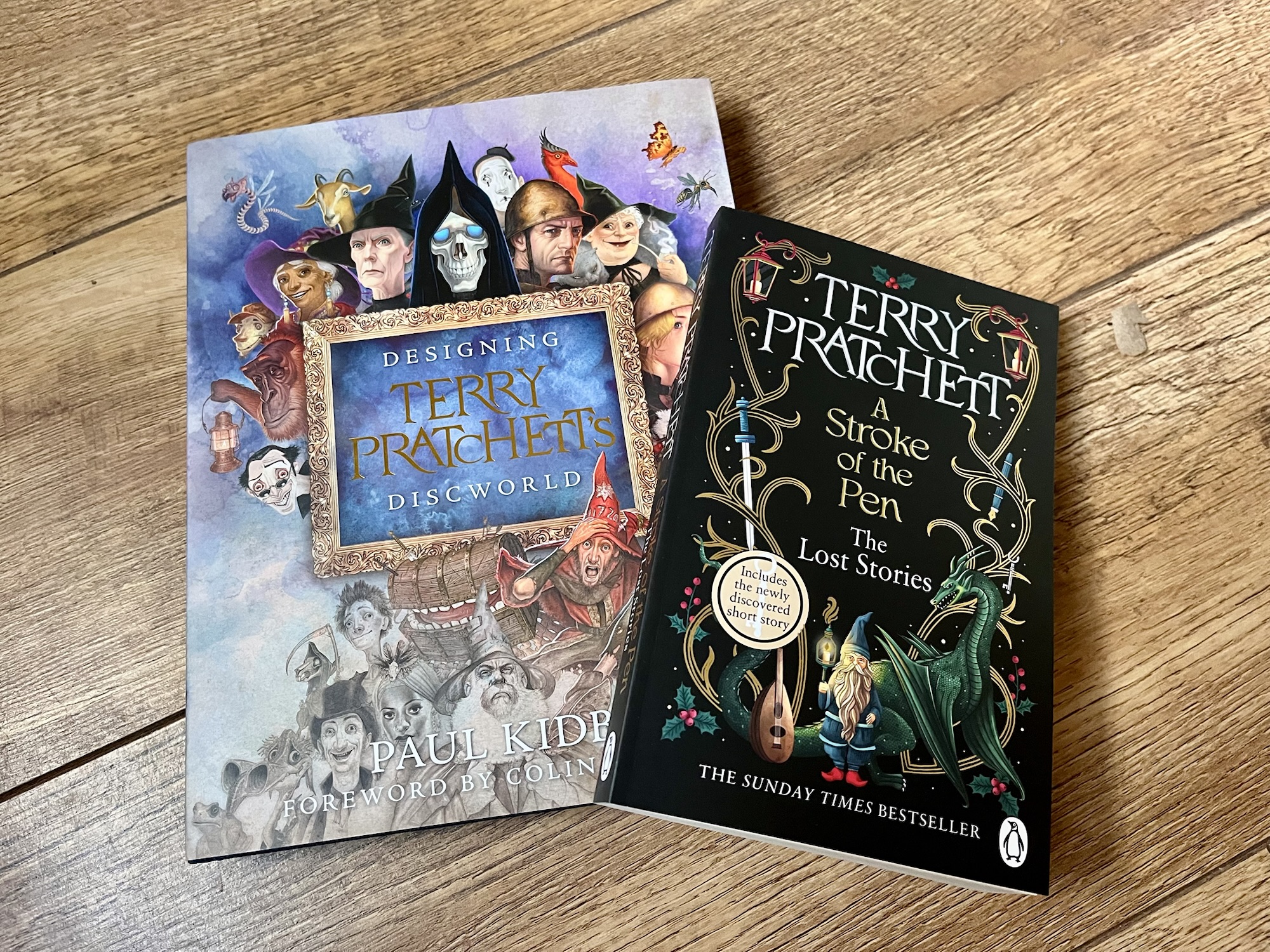 Photos of the two books that I bought Christine for Christmas: A Stroke of the Pen by Terry Pratchett, and Designing Terry Pratchett's Discworld by Paul Kidby