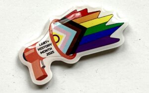 A photo of the official LGBT+ History Month 2025 badge.