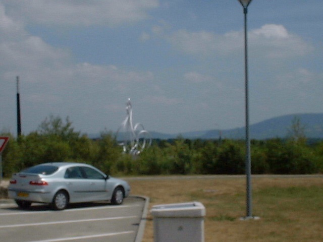 A photo of a giant steel chicken at le Poulet de Bresse service station in France