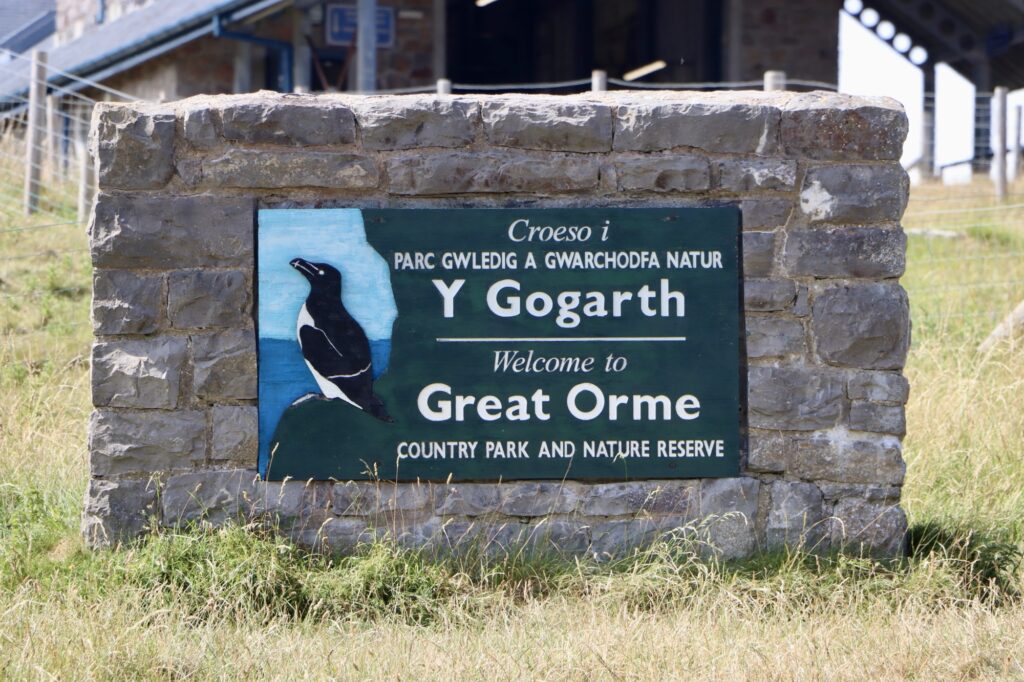 A photo of a sign welcoming people to the Great Orme country park