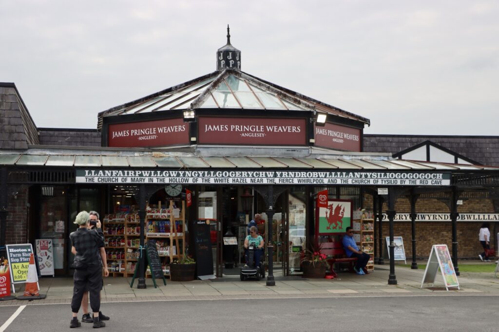 A photo of the outside of James Pringle Weavers at Llanfair­pwllgwyngyll­gogery­chwyrn­drobwll­llan­tysilio­gogo­goch station