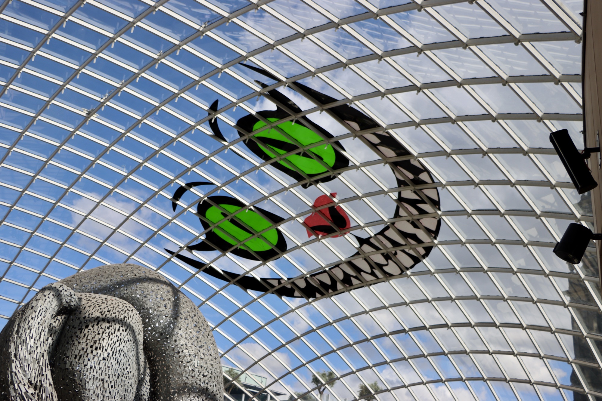 A depiction of the Cheshire cat on the roof of Trinity Leeds