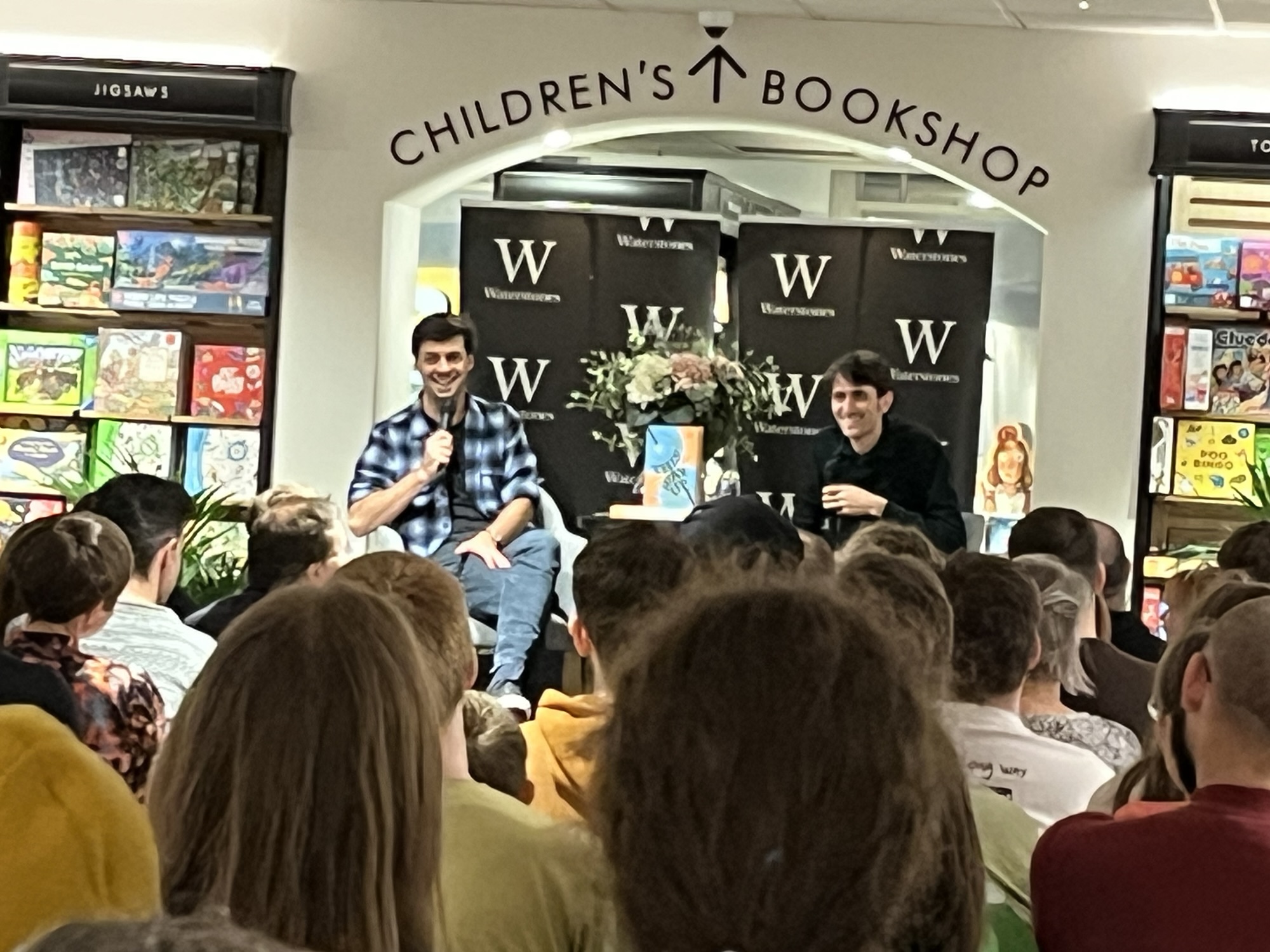 Mark Cooper-Jones and Jay Foreman, aka the Map Men, in front of a crowd at Waterstones in Leeds