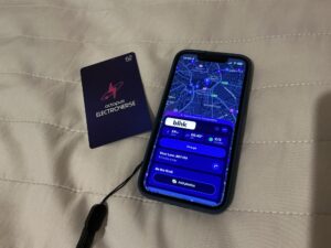 A photo of an Octopus Electroverse RFID card, and the Electroverse app open on an iPhone